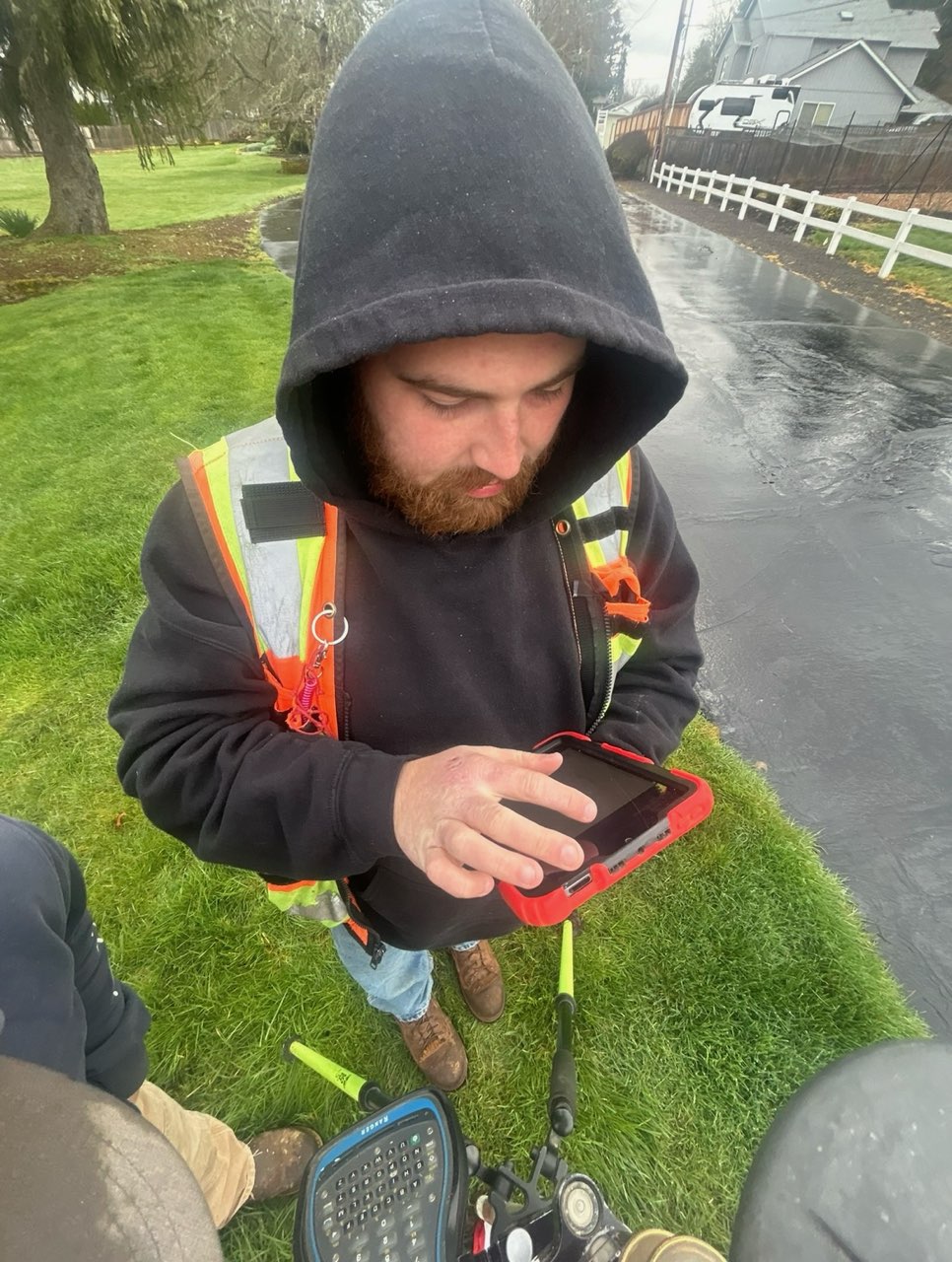 Alec Olson working with survey equipment