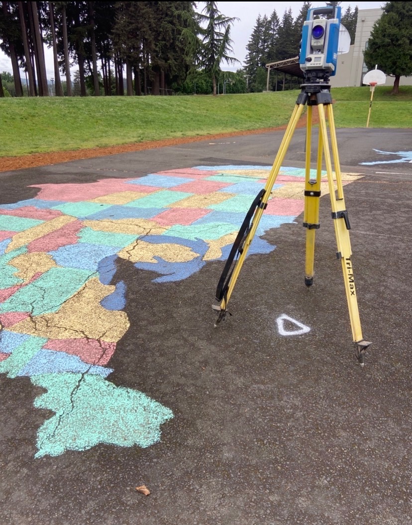 Survey instrument set up at a school playground