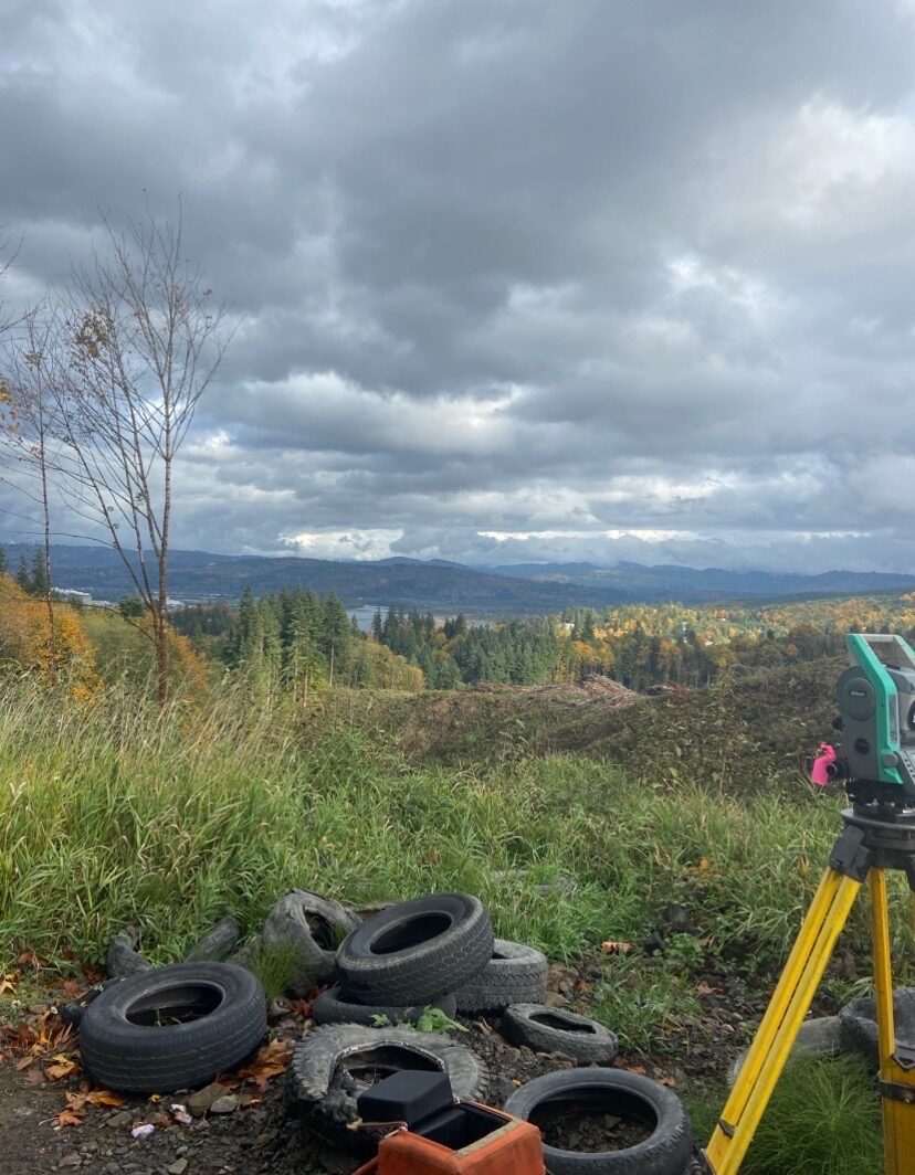 Survey equipment overlooking autumn hills and the Columbia River
